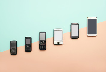 evolution of cell phones. technology development telephone and pda concept. vintage and new phones. 