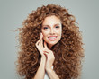© artmim - Young happy redhead woman with long healthy curly hair. Hair care concept.