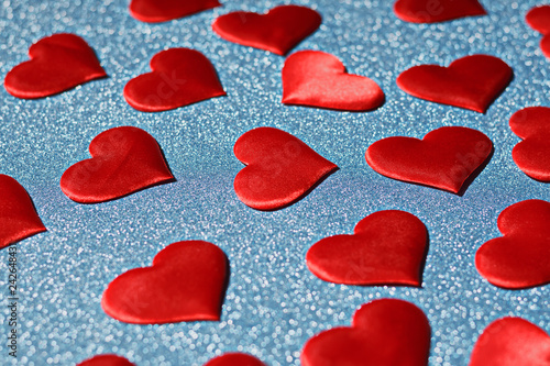 Fotografie, Obraz Closeup of a red heart on a blue shiny background. Valentine's d