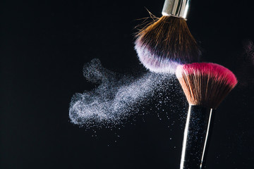 Makeup brush on black background