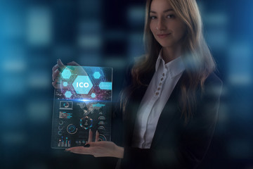 The concept of business, technology, the Internet and the network. A young entrepreneur working on a virtual screen of the future and sees the inscription: ICO