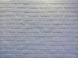 Abstract weathered modern white bricks wall background stucco in rural room . The brick work from stone tile which its was from modern paint technology.