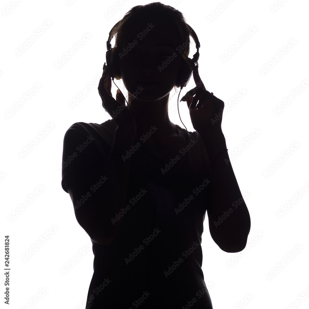 silhouette of a happy girl listening to music in headphones, figure of  young woman with hands, image size:1000x1000