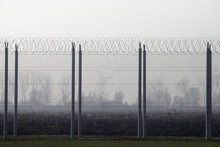 Prison Fence With Barbed Wire