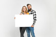 © Богдан Перфильев - young loving couple, bearded man and blondie are smiling, hugging, holding blank banner, isolated on white background, Advertisement concept. Mockup for design