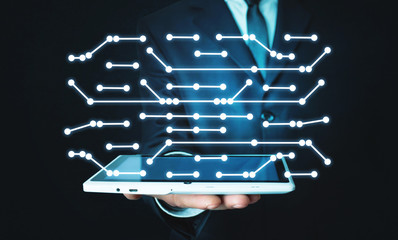 Wall Mural - man holding digital tablet. connecting dots technology. network