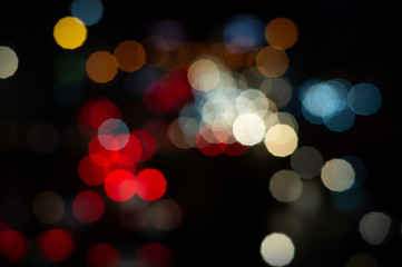 Wall Mural - Bokeh night light on the avenue Light night at city blue bokeh sky festival abstract background blur lens flare reflection beautiful circle street with dark