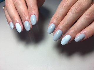 fashionable gray manicure with a blue design