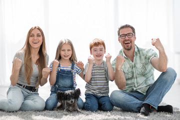 Wall Mural - happy family sitting in her new apartment