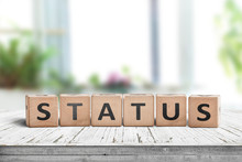 Status Sign Made Of Wood On A Table