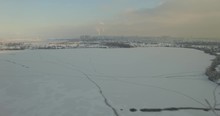 Drone Shot Of Frozen River In Forest.Frozen River Road In Rural Area.