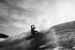 © Fabien Voileau - Surfer surfing in sea against cloudy sky