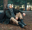 © Andrii - Pensive hipster guy wanderlust with touristic backpack enjoy tranquility during exploring nature environment, male hiker thinking about route to discover