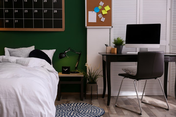 Canvas Print - Modern teenager room interior with comfortable bed against green wall