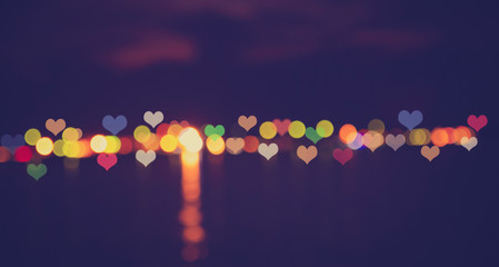 Wall Mural - Hearts bokeh on water reflex,love or romance concept for Valentine's day
