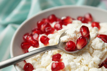 Tasty Cottage Cheese With Pomegranate Seeds In Bowl, Closeup