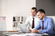 © Pixel-Shot - Young colleagues working together in modern office