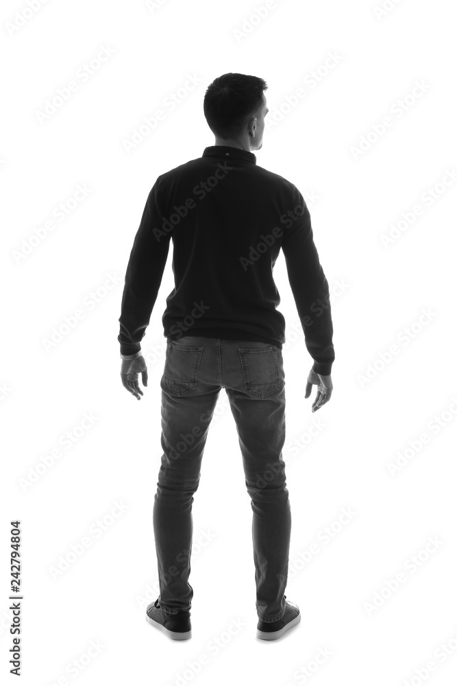 Young man on white background, back view