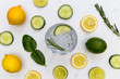Gin tonic cocktail drink glass with ice cucumber lime lemon white background