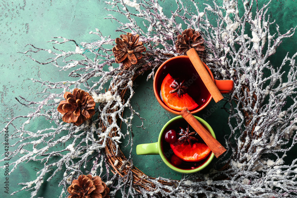 Christmas composition with tasty mulled wine on color background