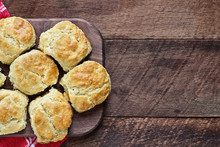 Fresh Buttermilk Southern Biscuits Or Scones Over A Rustic Wooden Table Shot From Above. Top View.