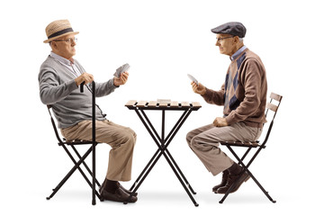 Sticker - Two senior men playing cards at a table