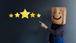 Customer Experience Concept. Woman Covered her head by Paper Bag with Happy Feeling Face and Pointing Hand to Five Star Services Rating Satisfaction. Client's Feedback and Online Review