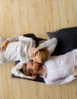 © BGStock72 - Loving young couple lying and kissing on the floor