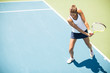 © BGStock72 - Young woman playing tennis