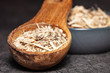 Dried root of siberian ginseng on dark background - medicine alternative