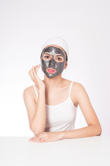 beautiful woman masking her face on white background