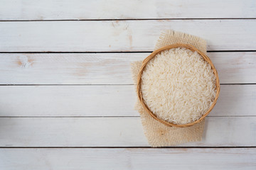 Wall Mural - Thai Jasmine rice on wooden bowl with copy space,Top view.