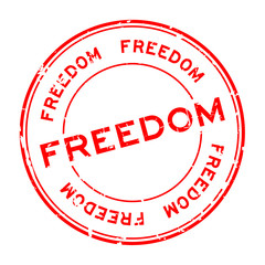 Wall Mural - Grunge red freedom round rubber seal stamp on white background