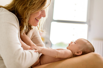 Sticker - Pretty carefree baby happy with her mommy