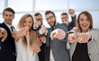 © ASDF - close up.a group of young business people pointing at you