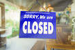 © ant - Sorry we are closed sign hang on door of business shop.