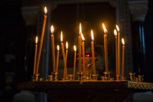 Many Burning Wax Candles In The Orthodox Church Or Temple