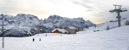 Cuadros en Lienzo ski slopes with skiers at sunset. Trentino, Italy