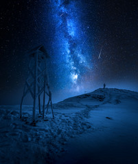 Wall Mural - milky way over a man in tatras in winter