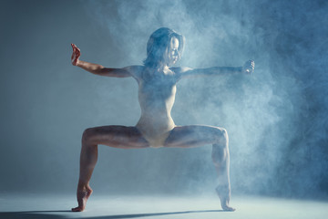 dancing in cloud concept. muscle brunette beauty female girl adult woman dancer athlete in fog smoke
