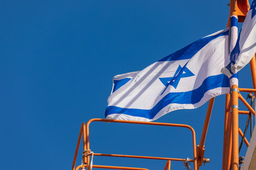 Wall Mural - The Israeli flag on the high crane at square front of the Wailing Wall