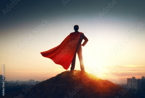 Cuadros en Lienzo superhero businessman looking at city