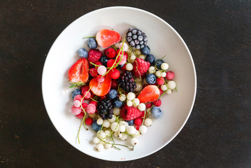 Wall Mural - frozen berries on the white plate