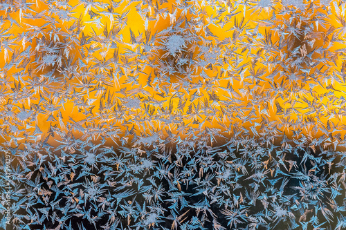 Fotografiet A beautiful horizontal texture in blue white and yellow color of frozen window g
