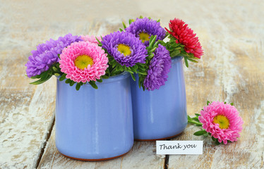 Wall Mural - Thank you card with colorful daisies in blue vase on rustic wooden surface
