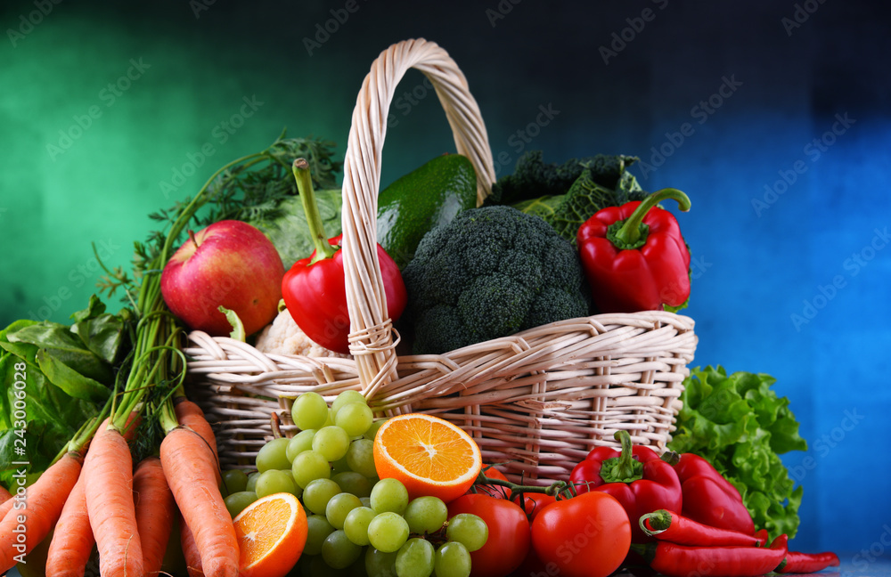 Fresh organic fruits and vegetables in wicker basket - obrazy, fototapety, plakaty 