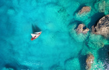 Yacht On The Sea From Top View. Turquoise Water Background From Top View. Summer Seascape From Air. Travel Concept And Idea
