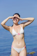 © azazello - Girl sunbathes at the sea