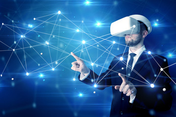 businessman in virtual reality goggles investigate global network connectivity concept