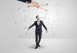 © ra2 studio - Little businessman controlled from above like a puppet concept